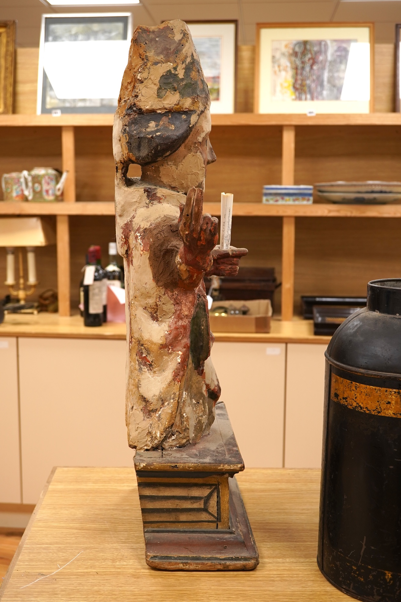 A 19th century and later Continental polychrome wood figure of a bishop, 77cm